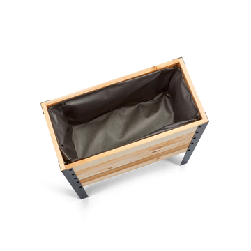 Wooden planter box with a dark interior on a white background