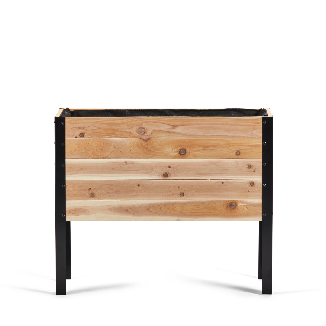 Wooden planter box with black metal frame on a white background