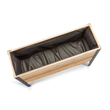 Wooden planter box with brown liner on a white background