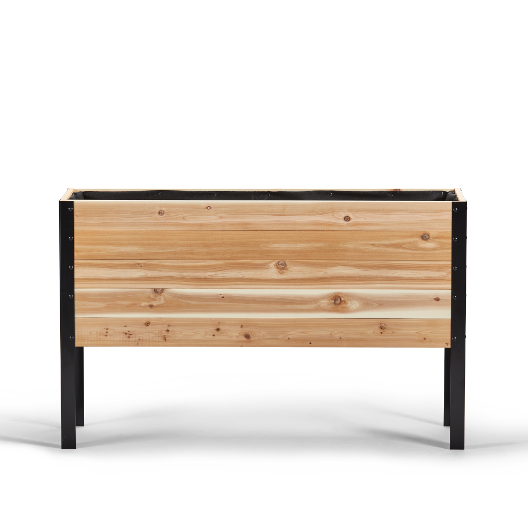 Wooden planter box with black metal frame on a white background