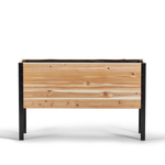 Wooden planter box with black metal frame on a white background