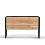 Wooden planter box with black metal frame on a white background