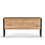 Wooden planter box with black metal frame on a white background