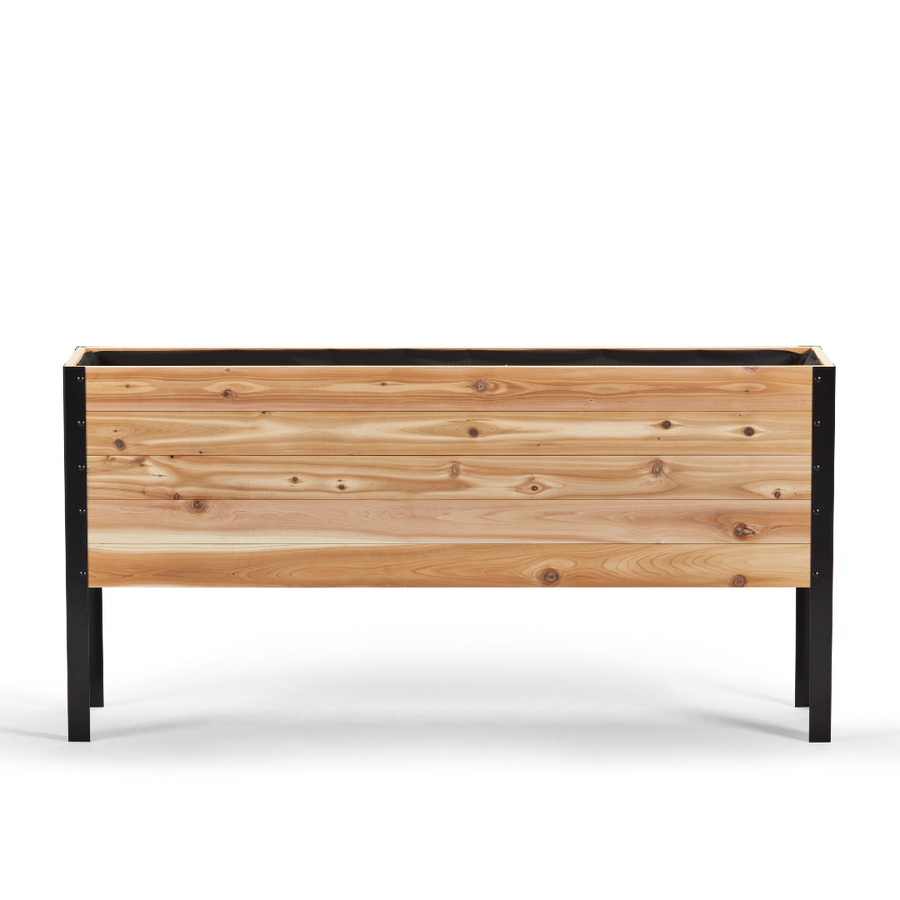 Wooden planter box with black metal frame on a white background