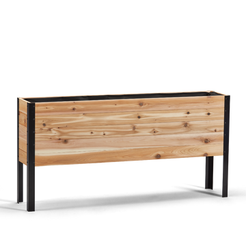 Wooden planter box with black metal frame on a white background