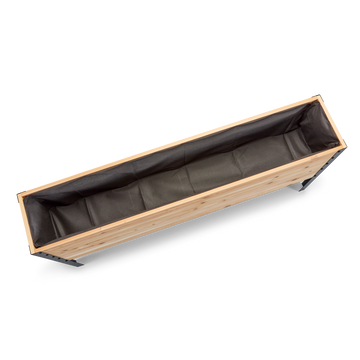 Rectangular planter with wooden frame and black liner on a white background