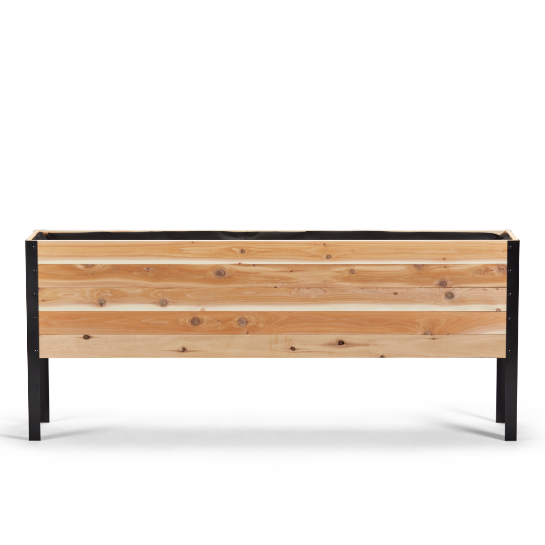 Wooden planter box with black metal frame on a white background