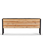 Wooden planter box with black metal frame on a white background