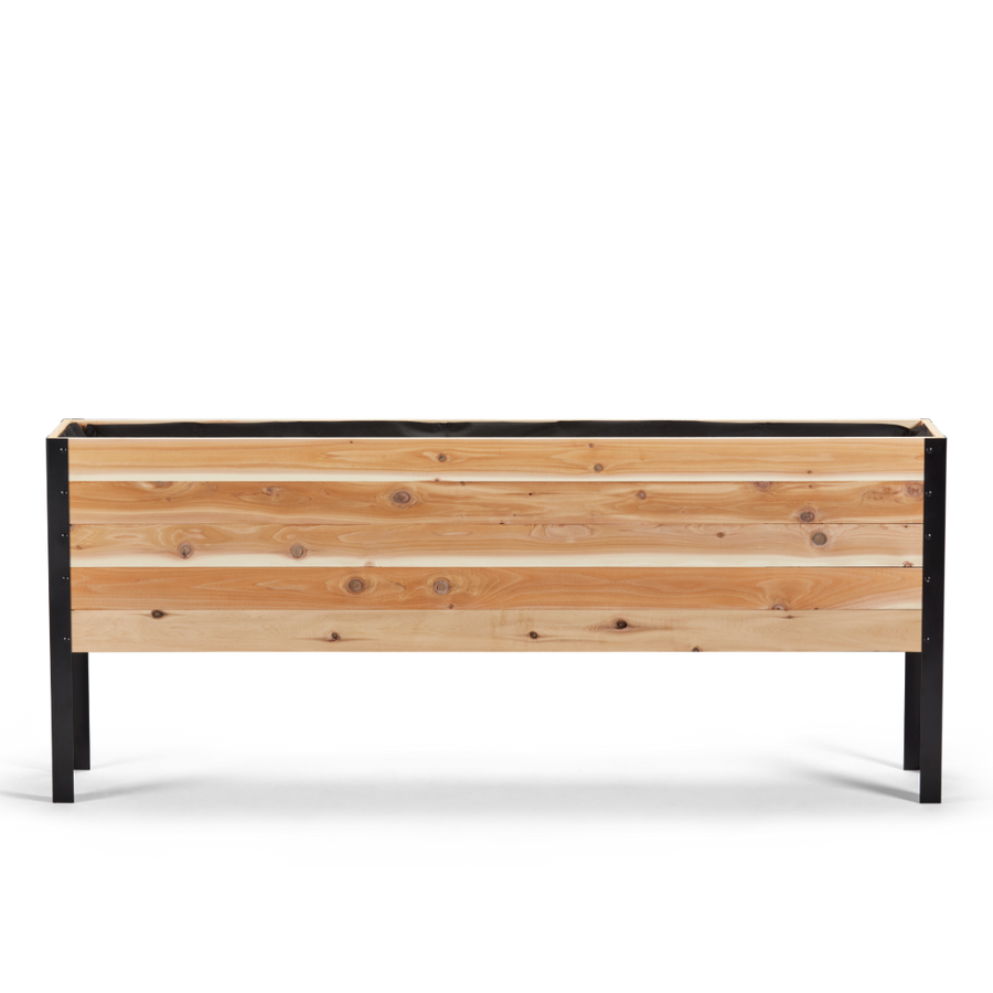 Wooden planter box with black metal frame on a white background