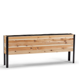 Wooden planter box with black metal frame on a white background